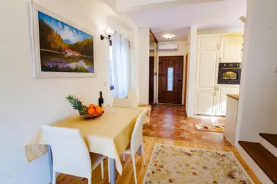 a kitchen and dining room with a table and chairs at 