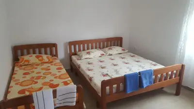 a bedroom with two bunk beds and a bedskirts at Apartments Diva in Dobra Voda