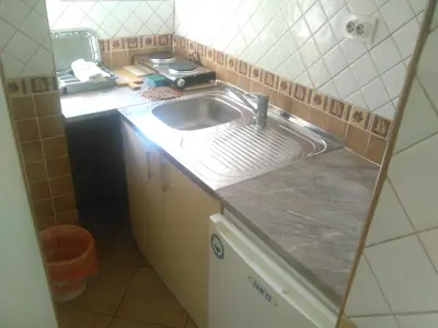 a kitchen with a sink and a counter top at Apartmani Pikula in Sutomore