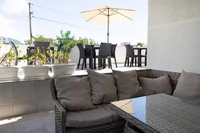 a living room with a couch and a table at Apartmani Novkovic in Bar