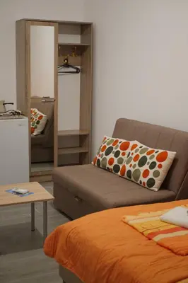 a living room with a couch and a table at Hostel Center in Ulcinj