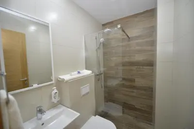 a bathroom with a sink and a toilet and a mirror at Posto Capitano C Group in Kotor
