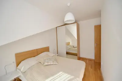 a bedroom with a bed and a large mirror at Posto Capitano C Group in Kotor