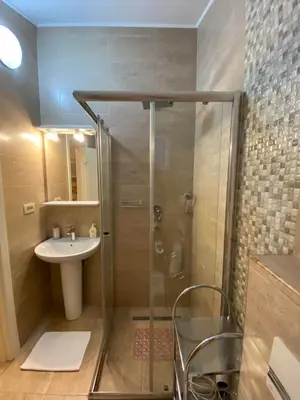 a bathroom with a shower and a sink at Apartmani Raskovic in Budva