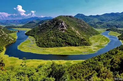 an aerial view of a river in the mountains at Estate & Winery San Duyevo in Rijeka Crnojevića
