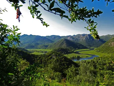 a view of a valley with a river and mountains at Estate & Winery San Duyevo in Rijeka Crnojevića