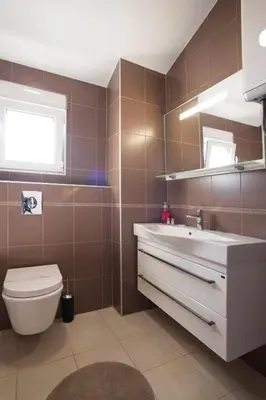 a bathroom with a sink and a toilet at Apartment Mitrovic in Budva