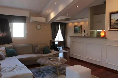 a living room with a couch and a table at Apartment Mitrovic in Budva