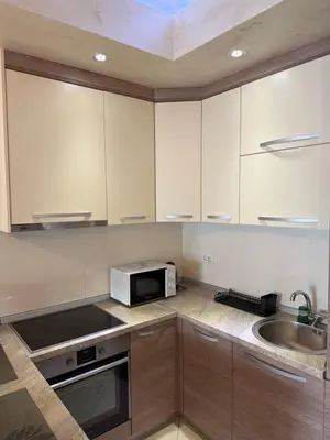 a kitchen with a microwave and a sink at Apartment Seaview Budva in Budva