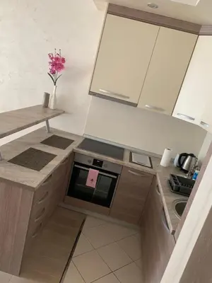 a small kitchen with a counter and a sink at Apartment Seaview Budva in Budva
