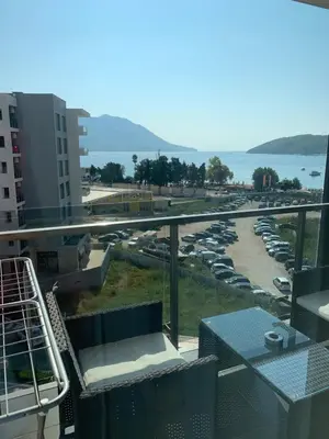 a view of a parking lot with cars parked at Apartment Seaview Budva in Budva