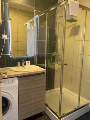 a bathroom with a shower and a sink at Apartment Seaview Budva in Budva