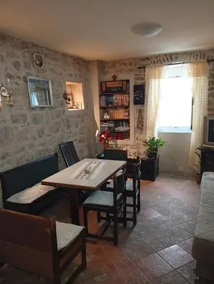 a dining room with a table and chairs at Apartment Radovic in Kotor