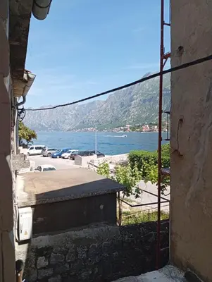 a view of the ocean from a building at Apartment Radovic in Kotor