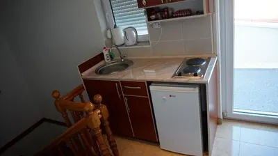a small kitchen with a sink and a stove at Borgo Del Silenzio,Apartment With Pool in Bar