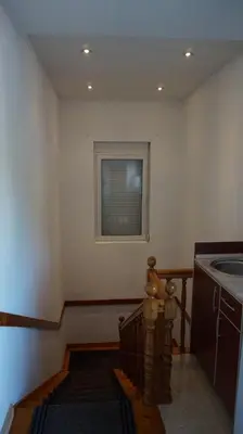 a bathroom with a staircase with a window and a sink at Borgo Del Silenzio,Apartment With Pool in Bar