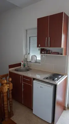 a small kitchen with a sink and a stove at Borgo Del Silenzio,Apartment With Pool in Bar