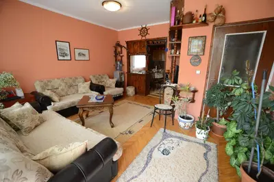 a living room with a couch and a table at President Holiday home in Utjeha