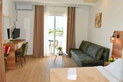 a living room with a couch and a table at Beach Walk Apartments in Ulcinj