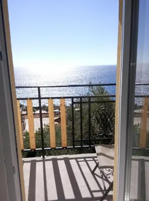 a view of the ocean from a balcony at Apartman Marinkovic in Dobra Voda