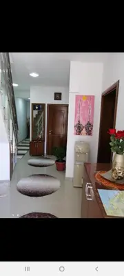 a hallway with three rugs on the floor of a room at Apartments Gazi in Ulcinj