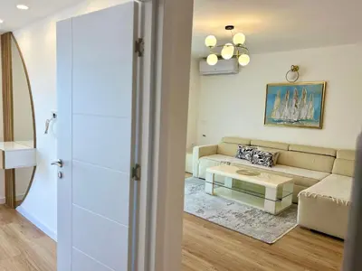 a living room with a couch and a table at Apartments Gazi in Ulcinj