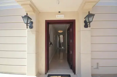 a hallway of a house with a door and lights at Villa St.George in Petrovac na Moru