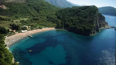 an aerial view of a beach with blue water at Villa St.George in Petrovac na Moru