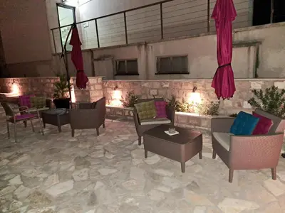 a living room with couches and chairs and a table at Apartments Kaladjurdjevic in Budva