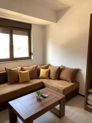 a living room with a couch and a coffee table at Apartments Kaladjurdjevic in Budva