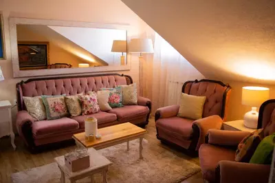 a living room with a couch and two chairs at Apartment Dadi in Cetinje