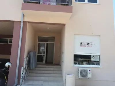 a building with stairs leading to a door at Apartment S&S Budva in Budva