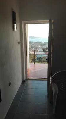 a hallway with a door to a balcony with a view at Apartment Panorama Vista 72 in Bar