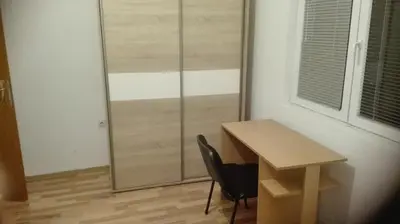 a desk and a chair in a room with a window at Apartment Panorama Vista 72 in Bar