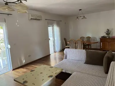 a living room with a couch and a table at Apartman Any Bar in Bar