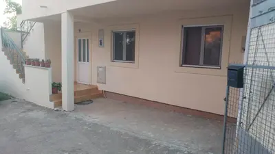 a house with a staircase and a stair case at Apartman Any Bar in Bar