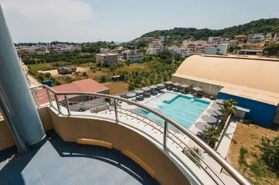 a balcony of a building with a swimming pool at Hotel Blue Moon in Ulcinj