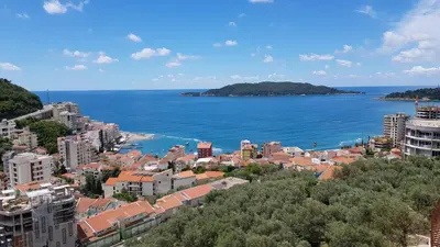 a view of a city and the ocean at Lux Apartment Vidovic in Rafailovici