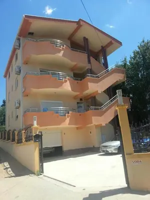 a large building with balconies on the side of it at Ago Apartmani in Dobra Voda