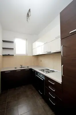 a kitchen with a sink and a stove in it at Apartments Drašković Mirišta in Petrovac na Moru