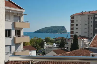 a view of the ocean from the roofs of buildings at City & Sea Apartments in Budva