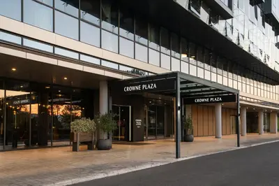 an office building with a sign that reads comedia plaza at Crowne Plaza Podgorica by IHG in Podgorica