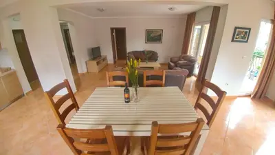 a dining room with a table and chairs at Villa Franeta Apartments in Budva
