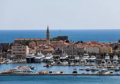 a group of boats are docked in a harbor at Budva Bay Breeze Apartments in Budva