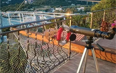 a camera on a balcony with a view of a boat at Beautiful Apartment In Utjeha in Utjeha