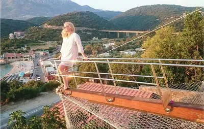 a man standing on the edge of a viewing deck at Beautiful Apartment In Utjeha in Utjeha