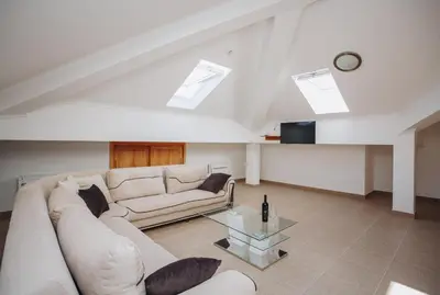 a living room with a couch and a table at Eco Winery Lipovac Apartments in Cetinje