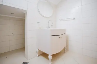 a white bathroom with a sink and a mirror at Eco Winery Lipovac Apartments in Cetinje