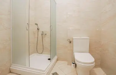 a bathroom with a shower and a toilet in it at Apartment near Ponta Nova of Rafailovici in Becici
