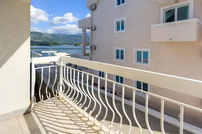 a balcony with a view of a building at Apart-hotel Villa Lav in Tivat